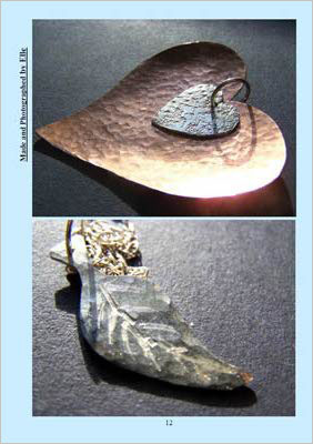 Two pieces of jewellery, one in shape of heart, one a leaf; both metallic.