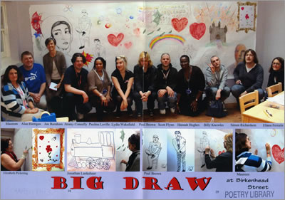 Photo shows the group at Birkenhead Street with a wall of illustrations behind them.